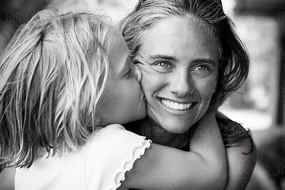 Little Blonde Girl Kisses Mother by Stocksy Contributor Sara Remington -  Stocksy