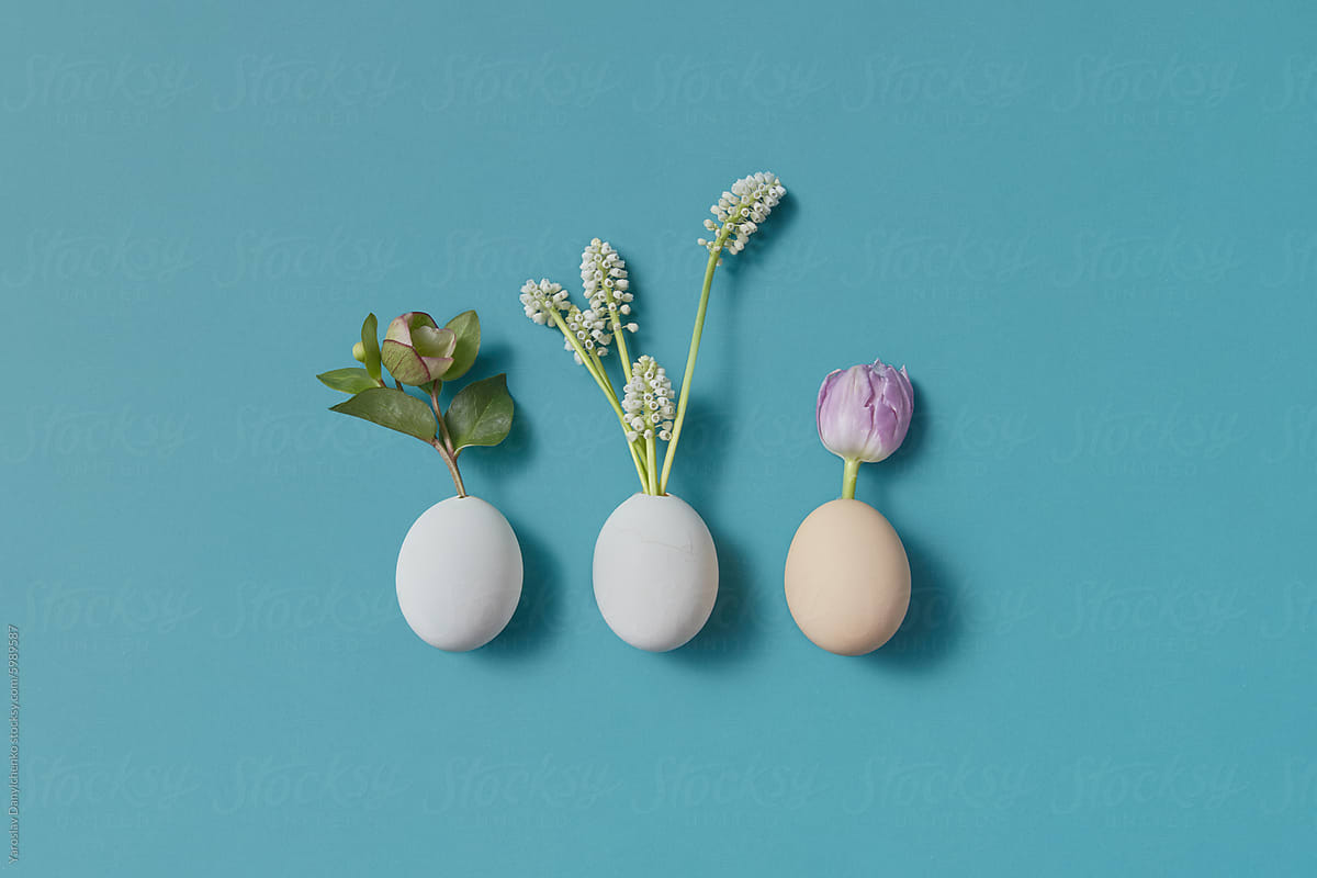 Stylish handmade set of three chicken eggs with blooming plants