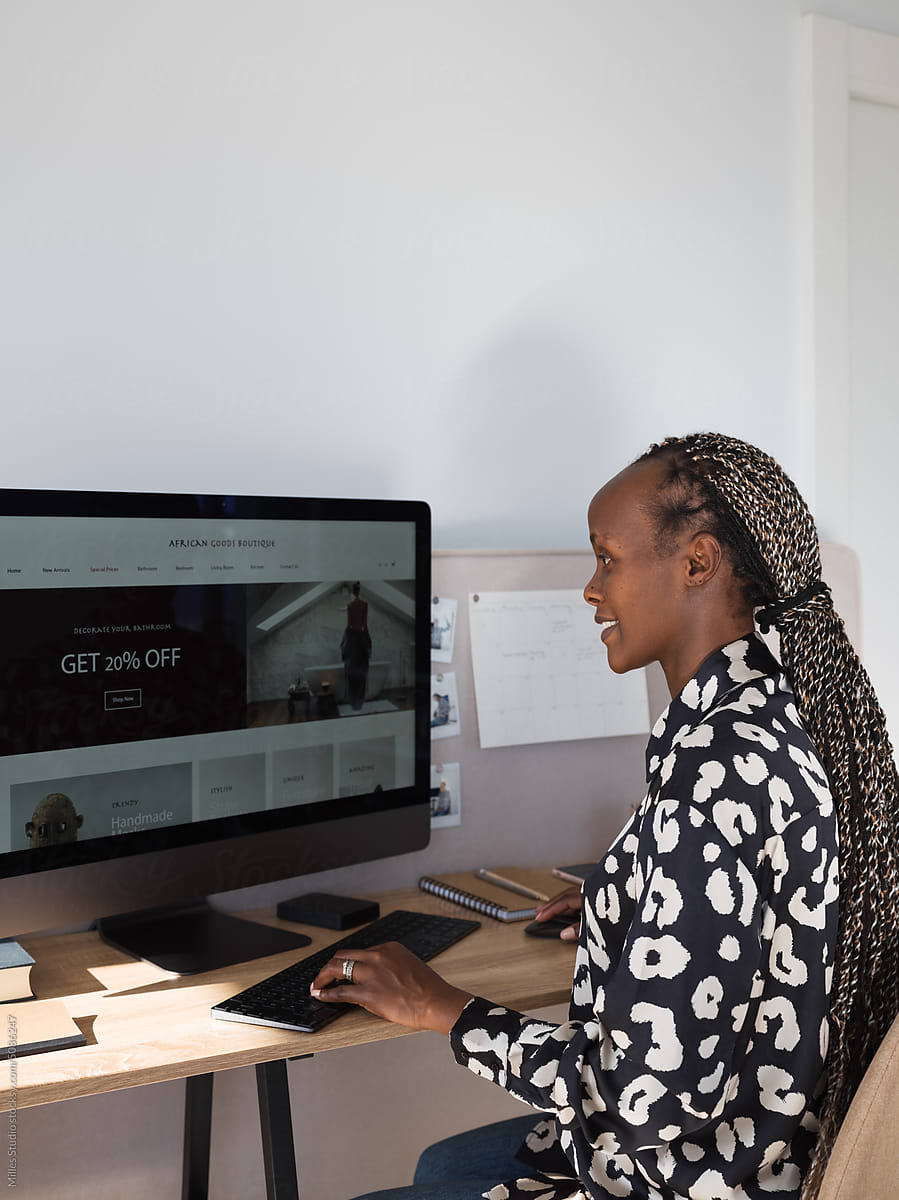 Cheerful black female freelancer working remotely