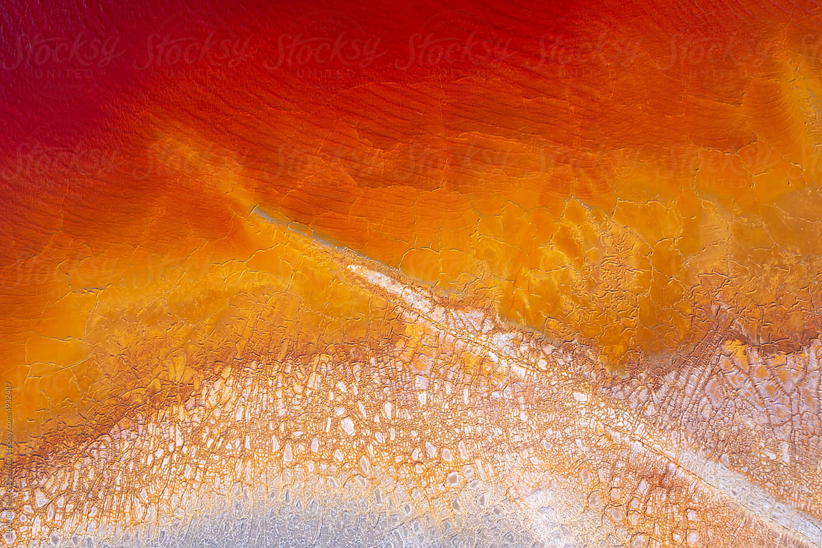 Abstract flowing rivers on vibrant orange, blue, red colors. Top view