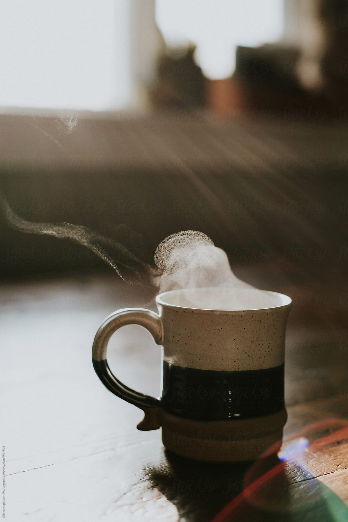 Steaming Coffee  Cup On Table by Alicia Magnuson 