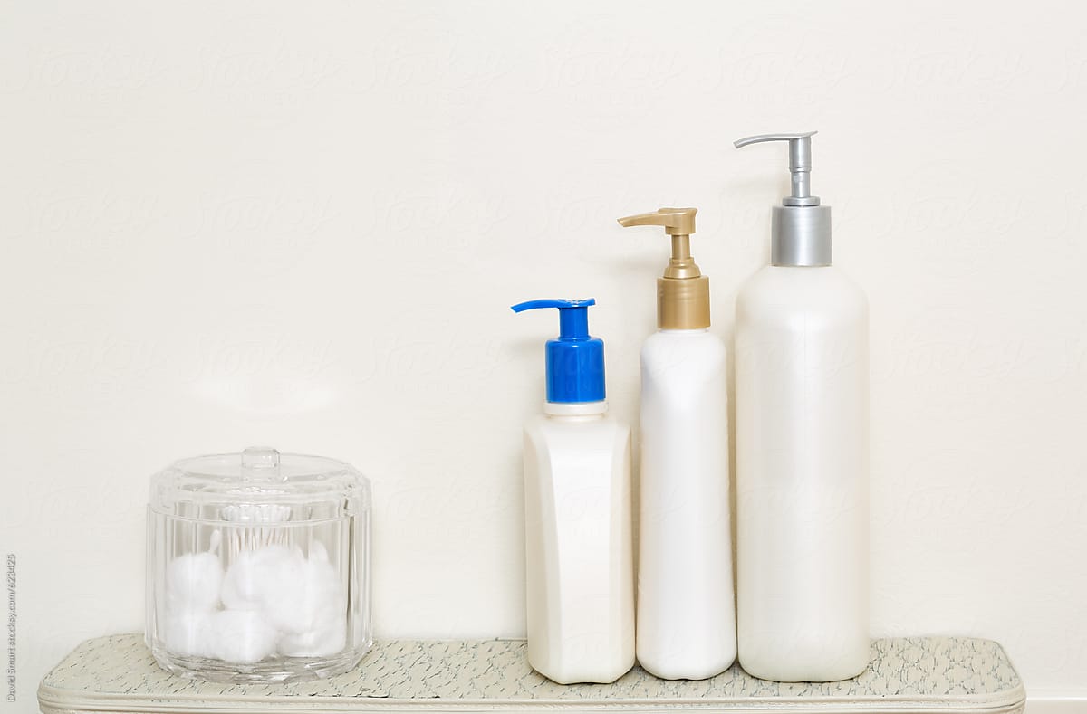 Lotion bottles and container with cotton balls