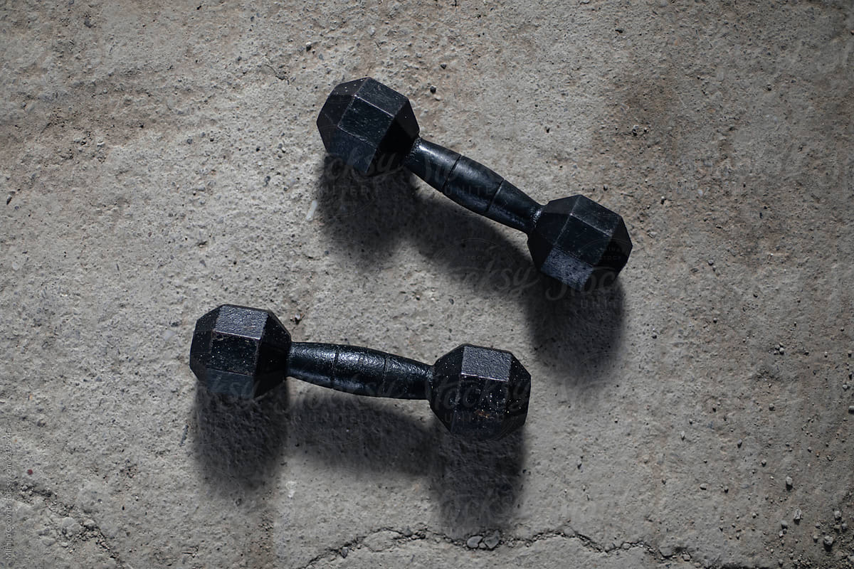Weights On A Concrete Background By Stocksy Contributor Mihajlo Ckovric Stocksy