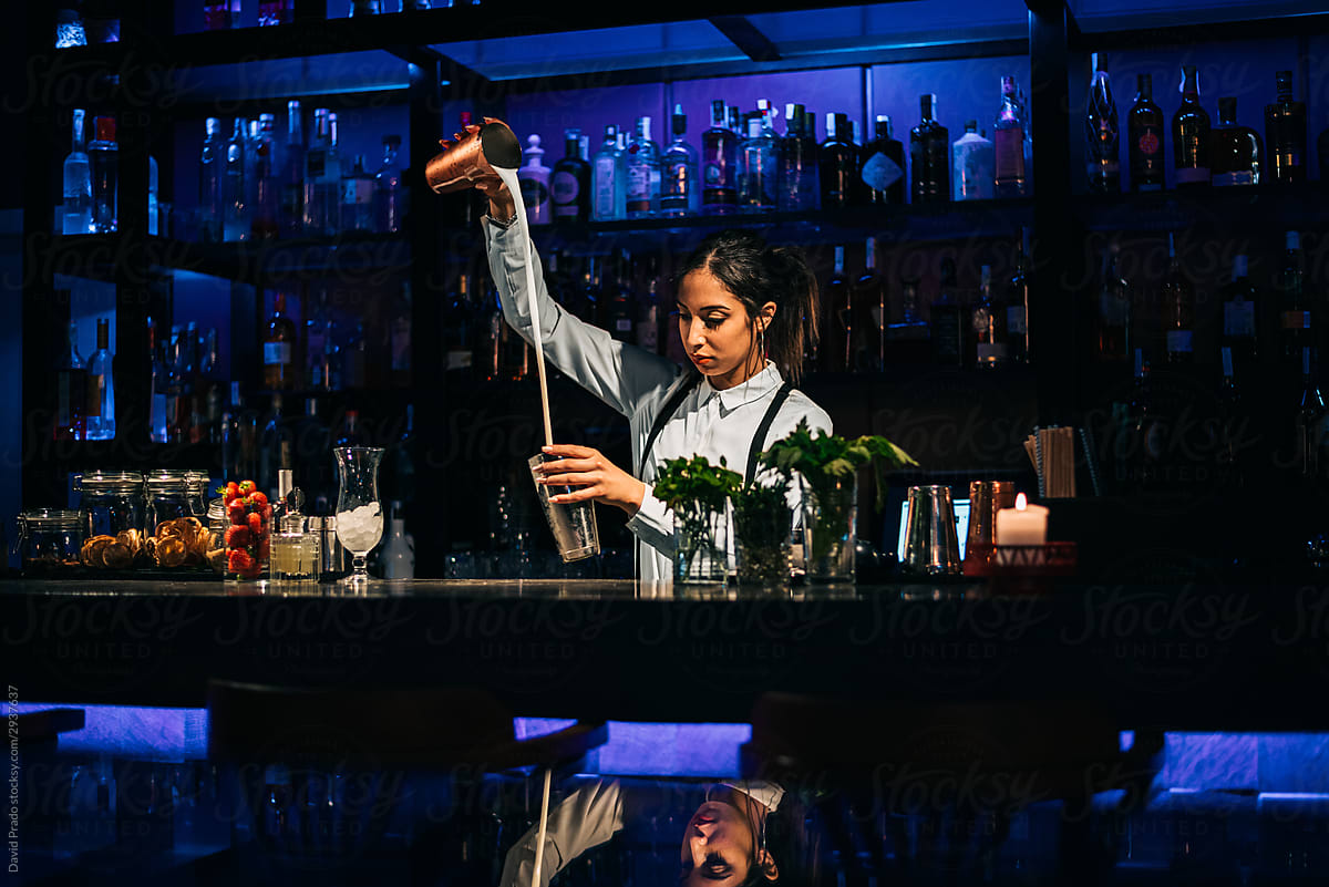 Bartender Mixing Cocktail In Bar Del Colaborador De Stocksy David Prado Stocksy