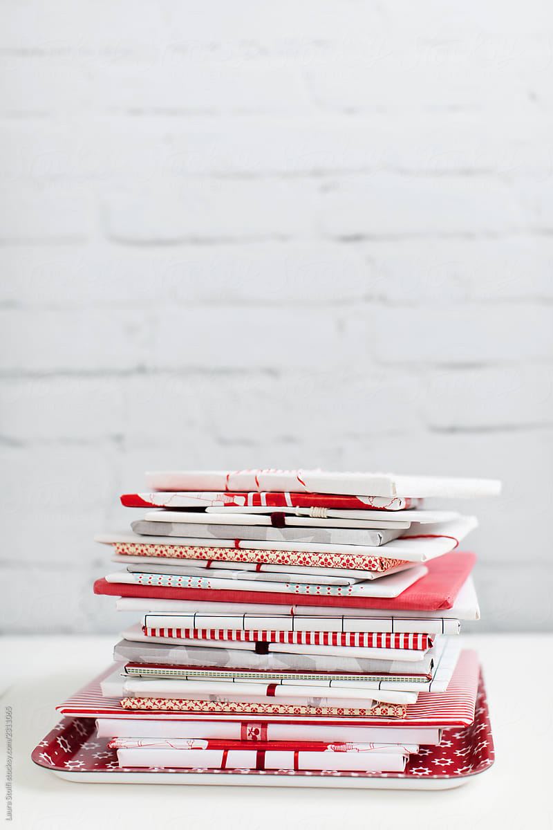 Pile of books wrapped as presents in red and white