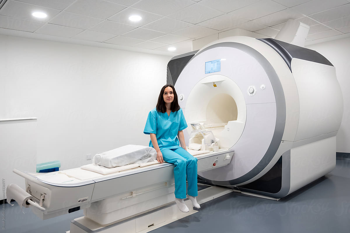 Female sitting on medical MRI scan