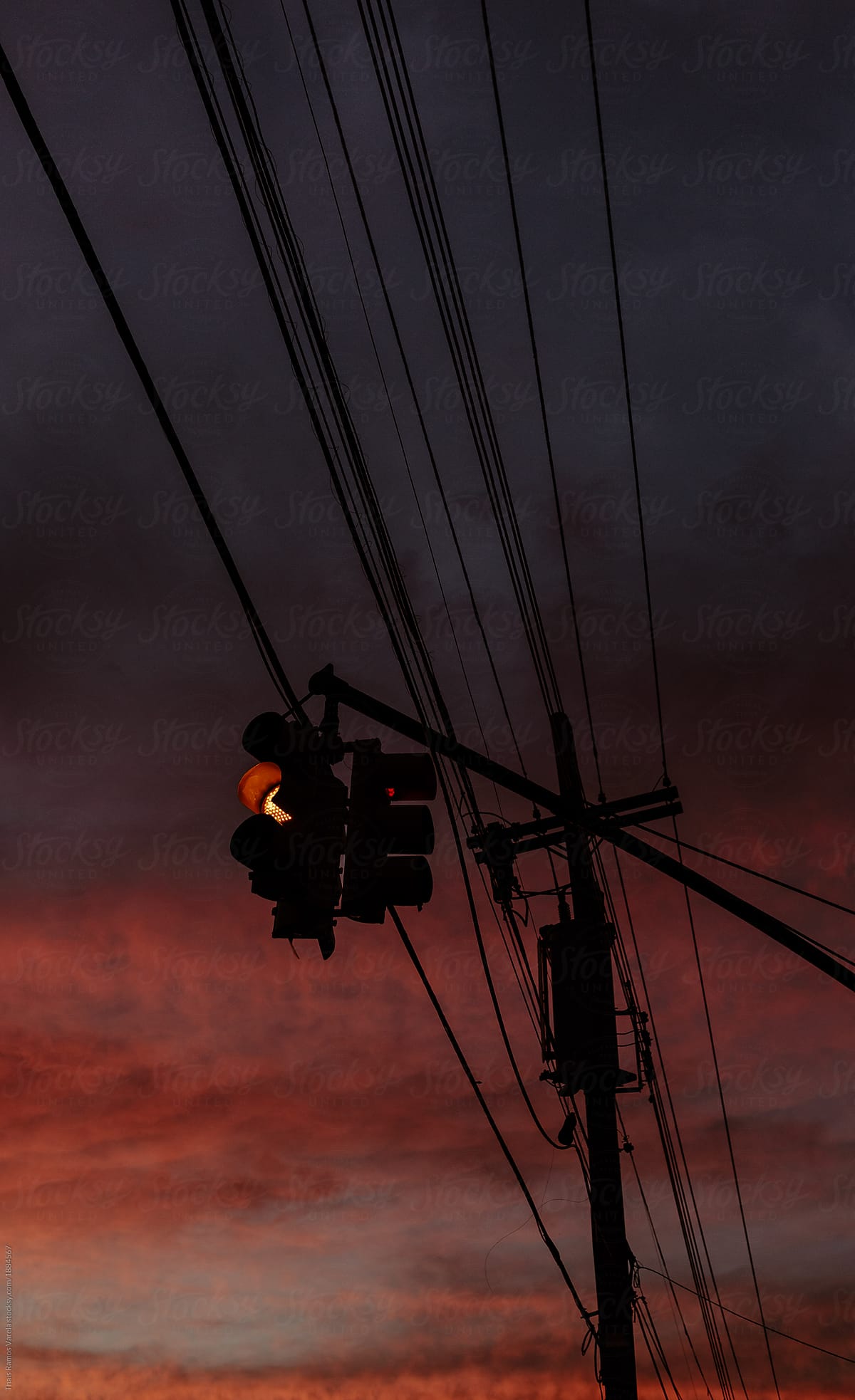 streetlight on a fire orange sky