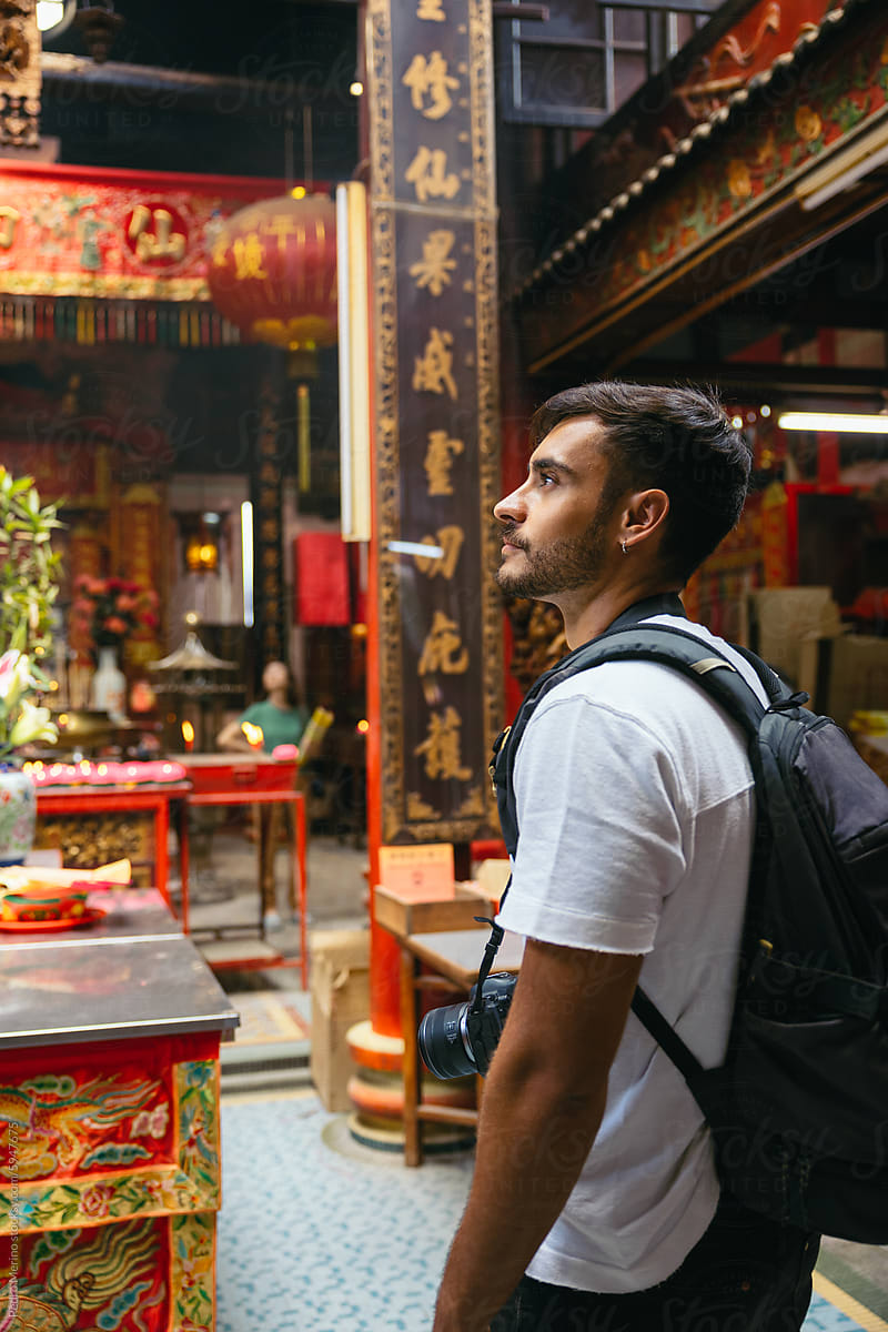 Man visiting an ancient Chinese Taoist temple