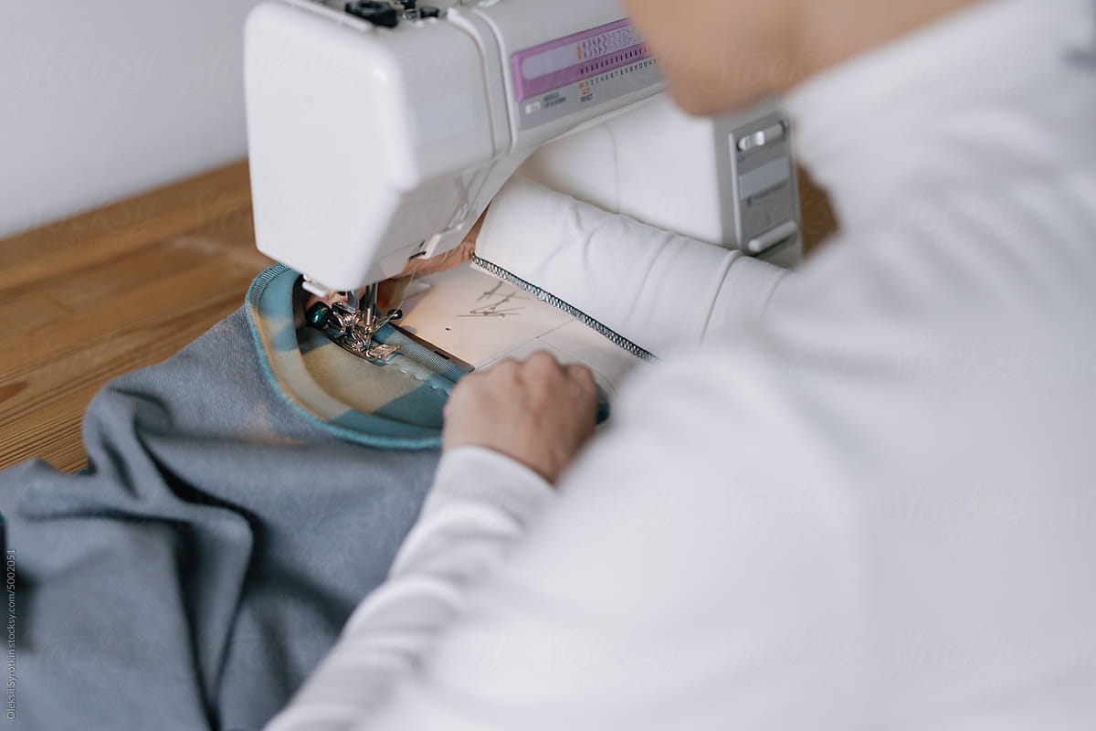 Seamstress. Stitches. Textile machine. Special device. Appliance