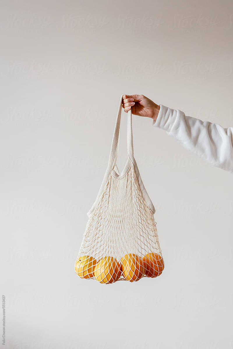 Woman With Eco Friendly Shopping Bag And Oranges