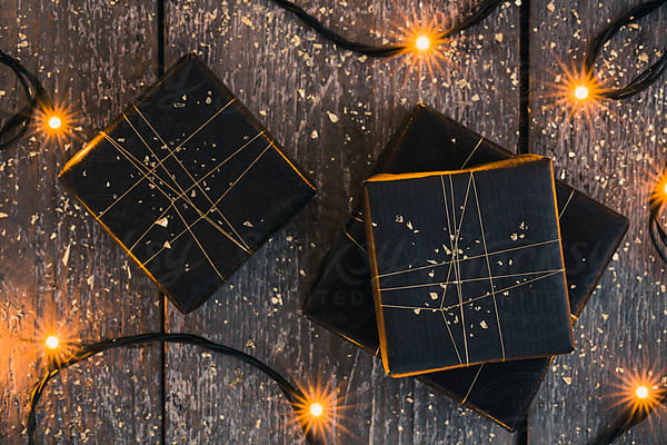 Stacked Gifts In Modern Black And Gold Wrapping Paper by Stocksy  Contributor Lior + Lone - Stocksy