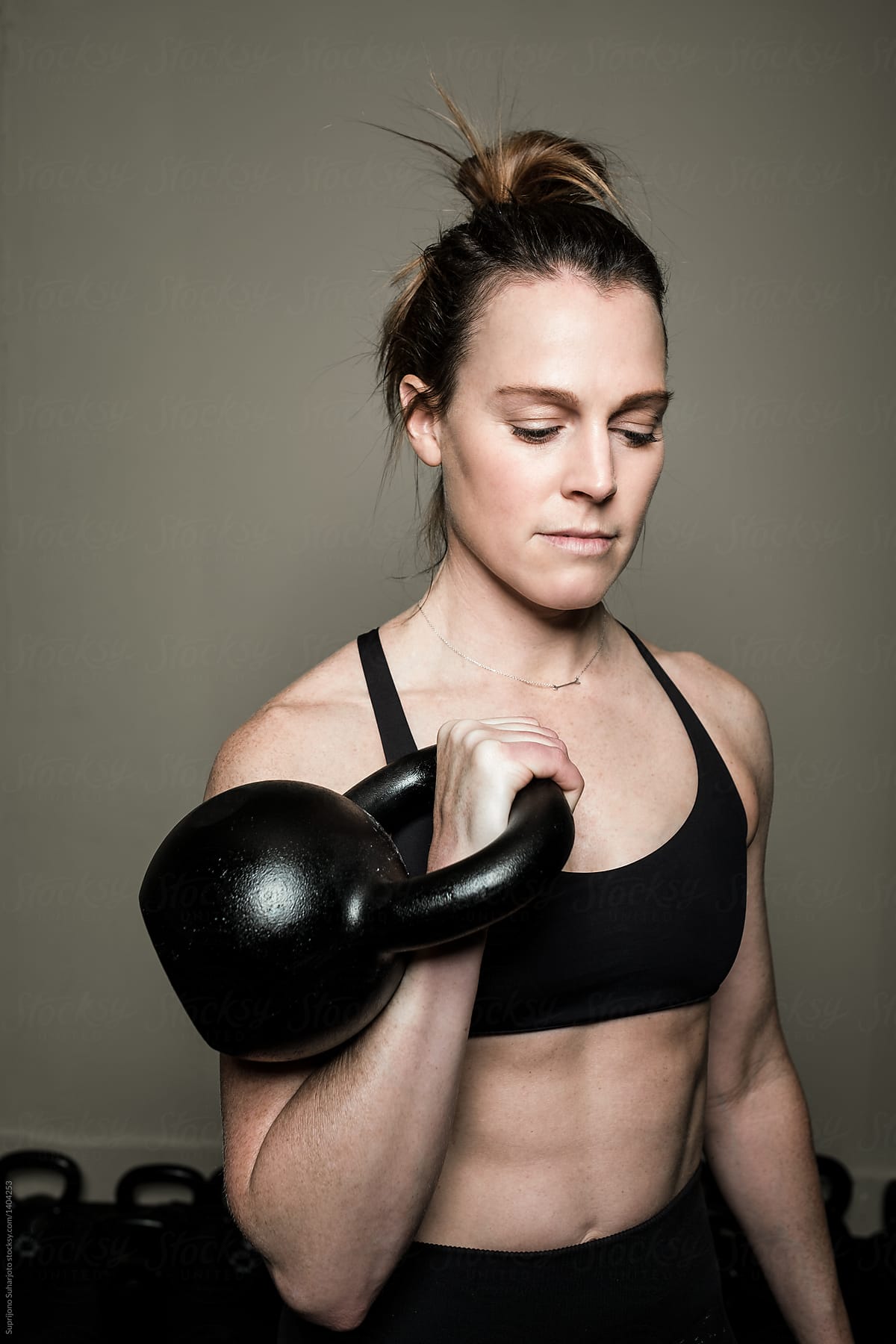 Woman Working Out In The Home Gym With Kettle Bell By Stocksy Contributor Take A Pix Media