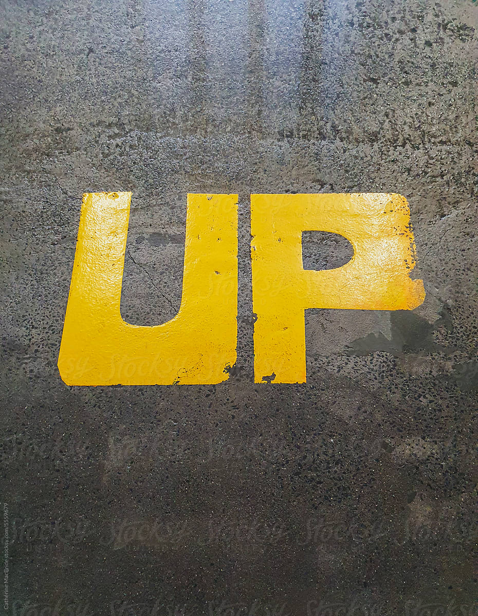 Up, painted on a parking garage floor