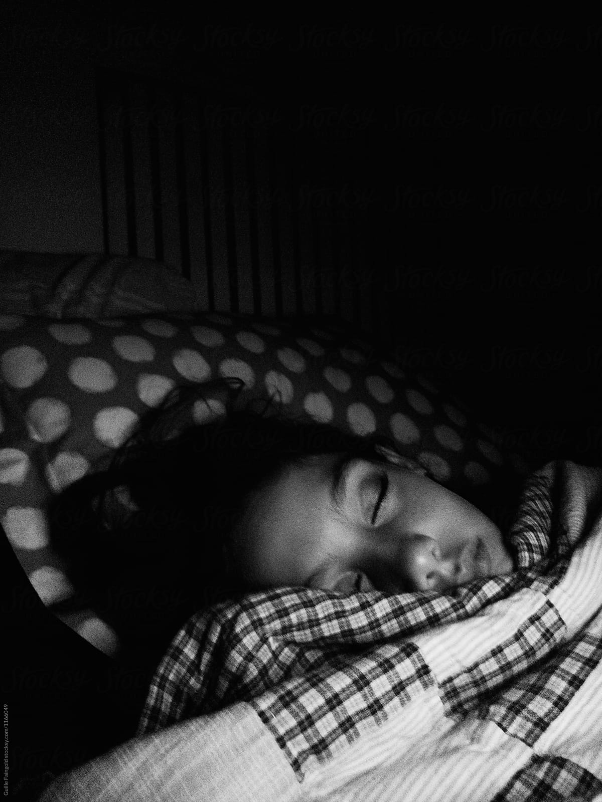 Sleeping girl in bed.