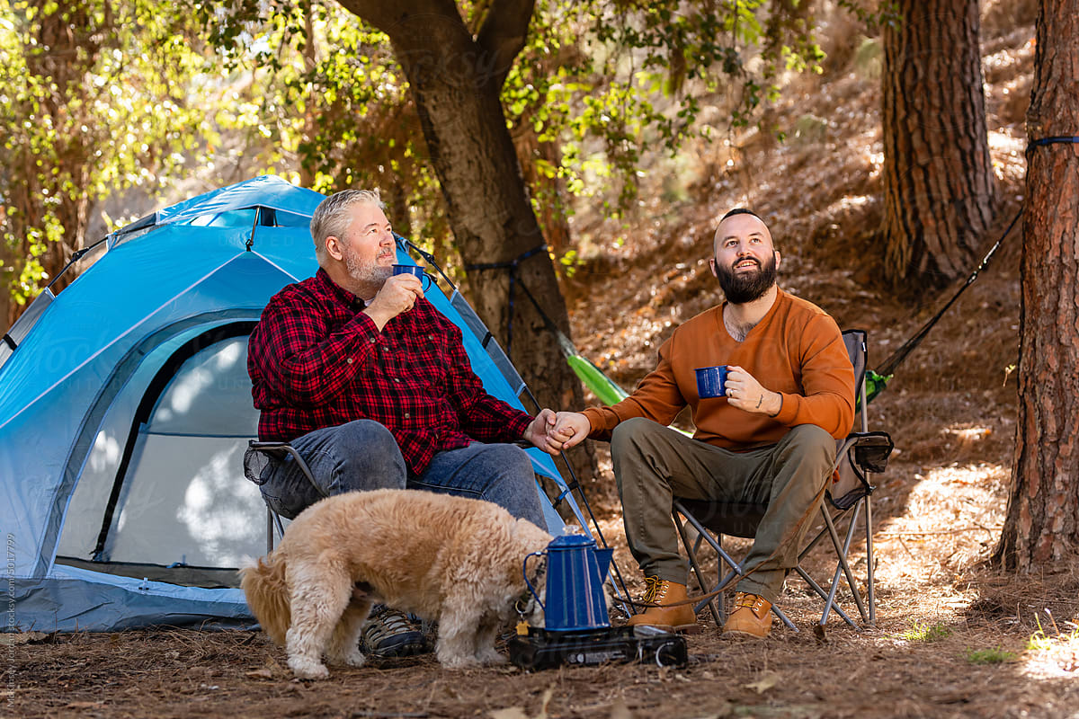 LGBT Couple Enjoy Freshly Brewed Coffee At Their Campsite