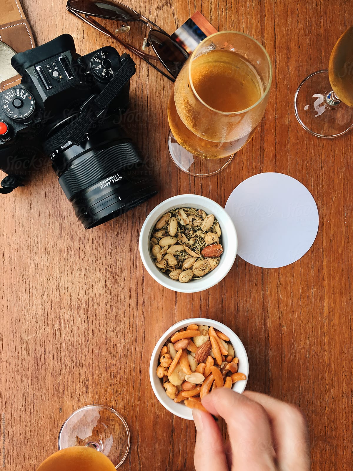 Camera, berr and nuts on table at micro brewery