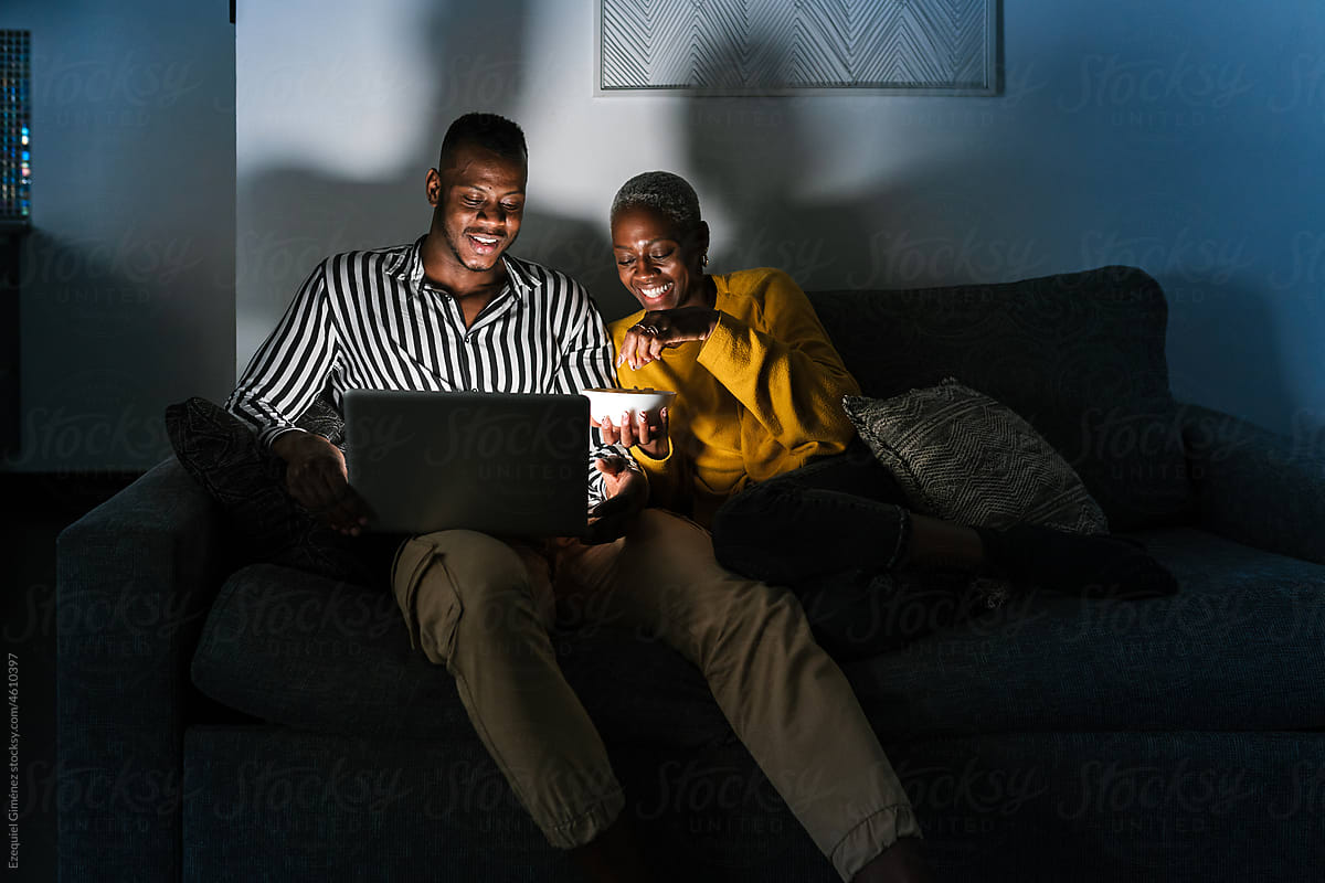 Positive African American couple during movie night