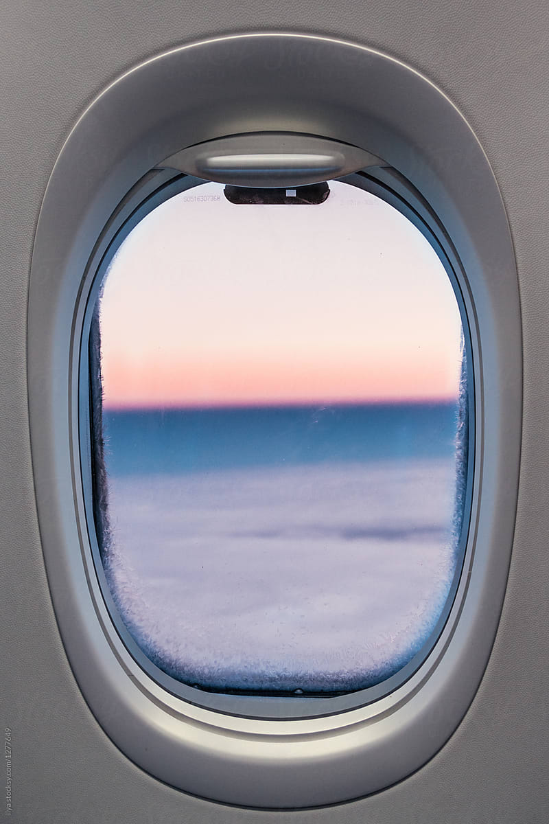 Travel fly plane window sunset