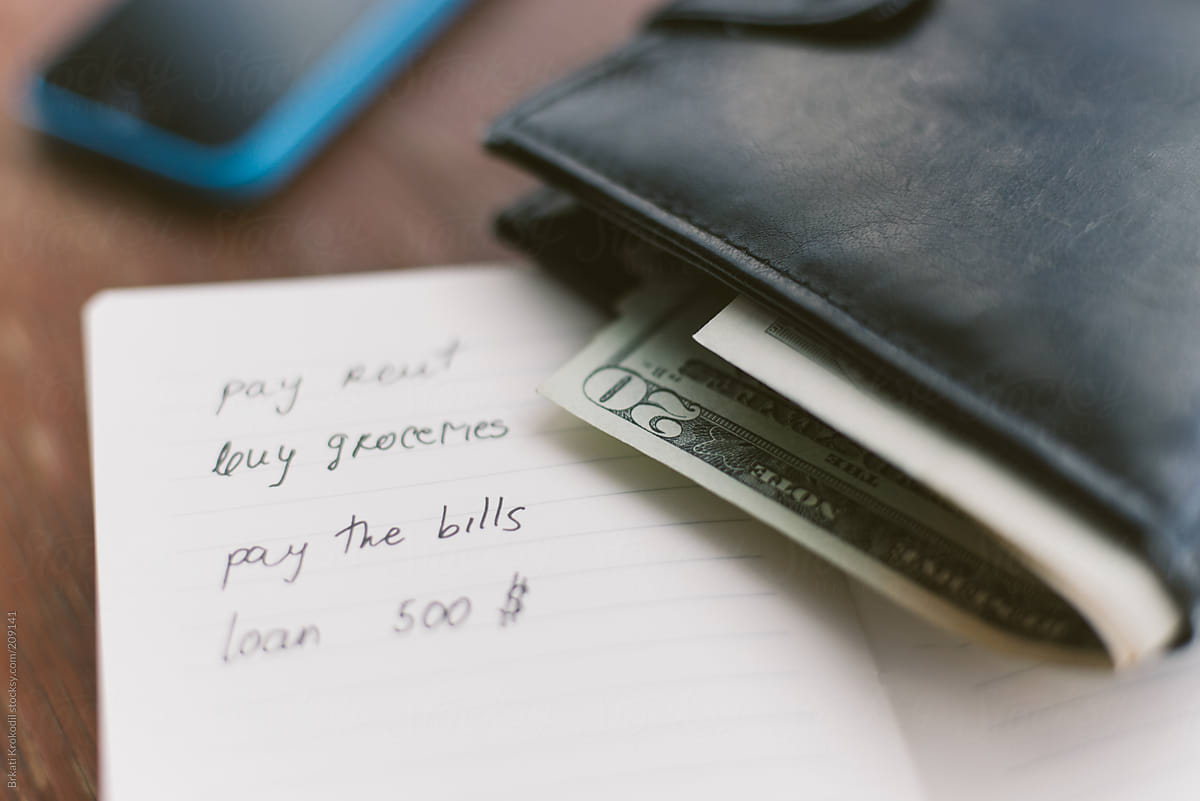 To Do List And A Wallet With Cash