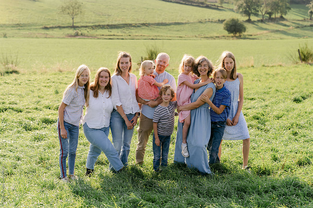 family with 8 children in field