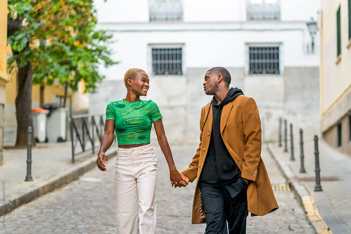 Black Couple Having A Romantic Walk On The Streets.