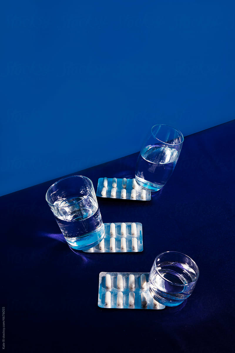 Pills under glasses of water