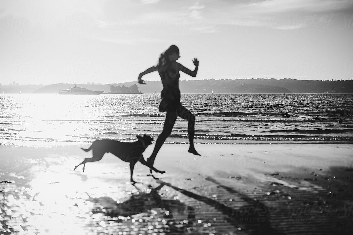 Woman at the beach with her dog