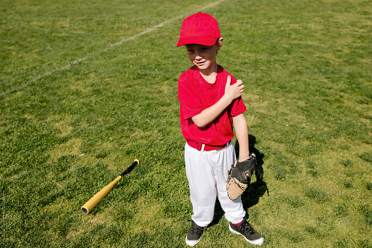 Young baseball player with glove and bat