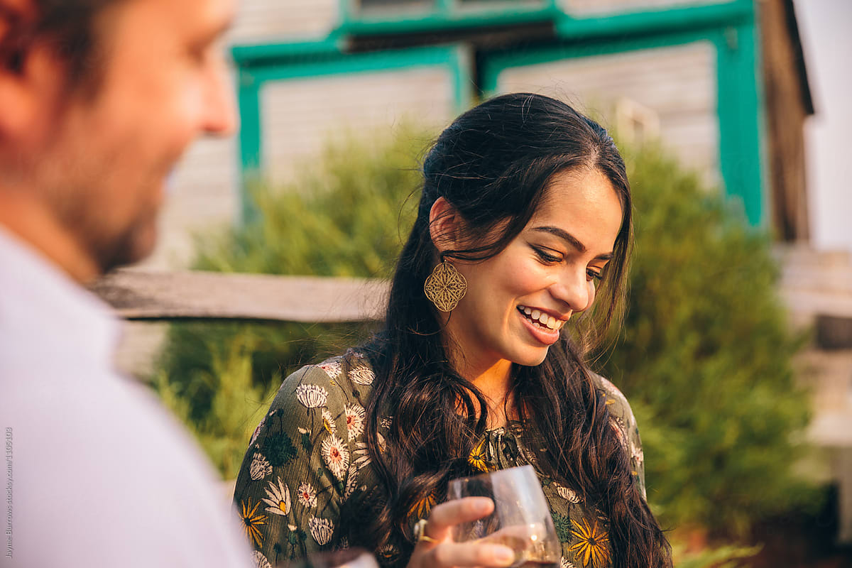 Woman Smiling At A Wine Party By Stocksy Contributor Jayme Burrows Stocksy