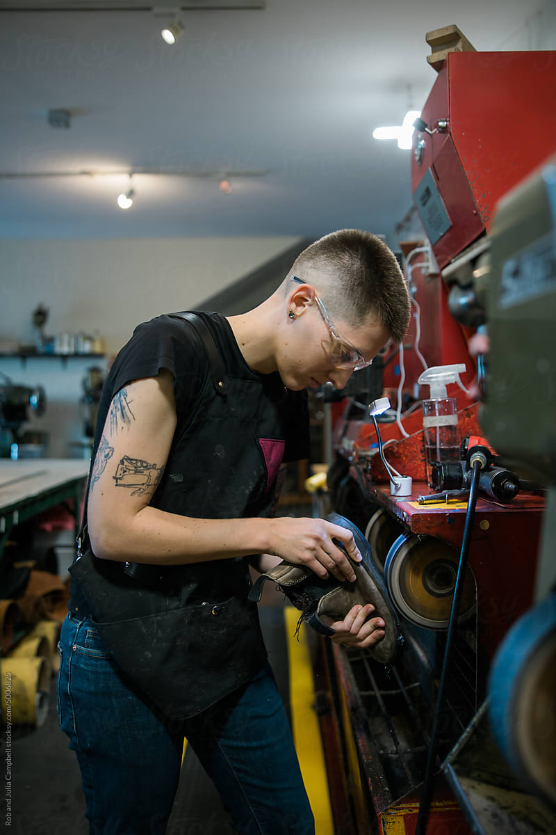 Worker fixing boot sole.