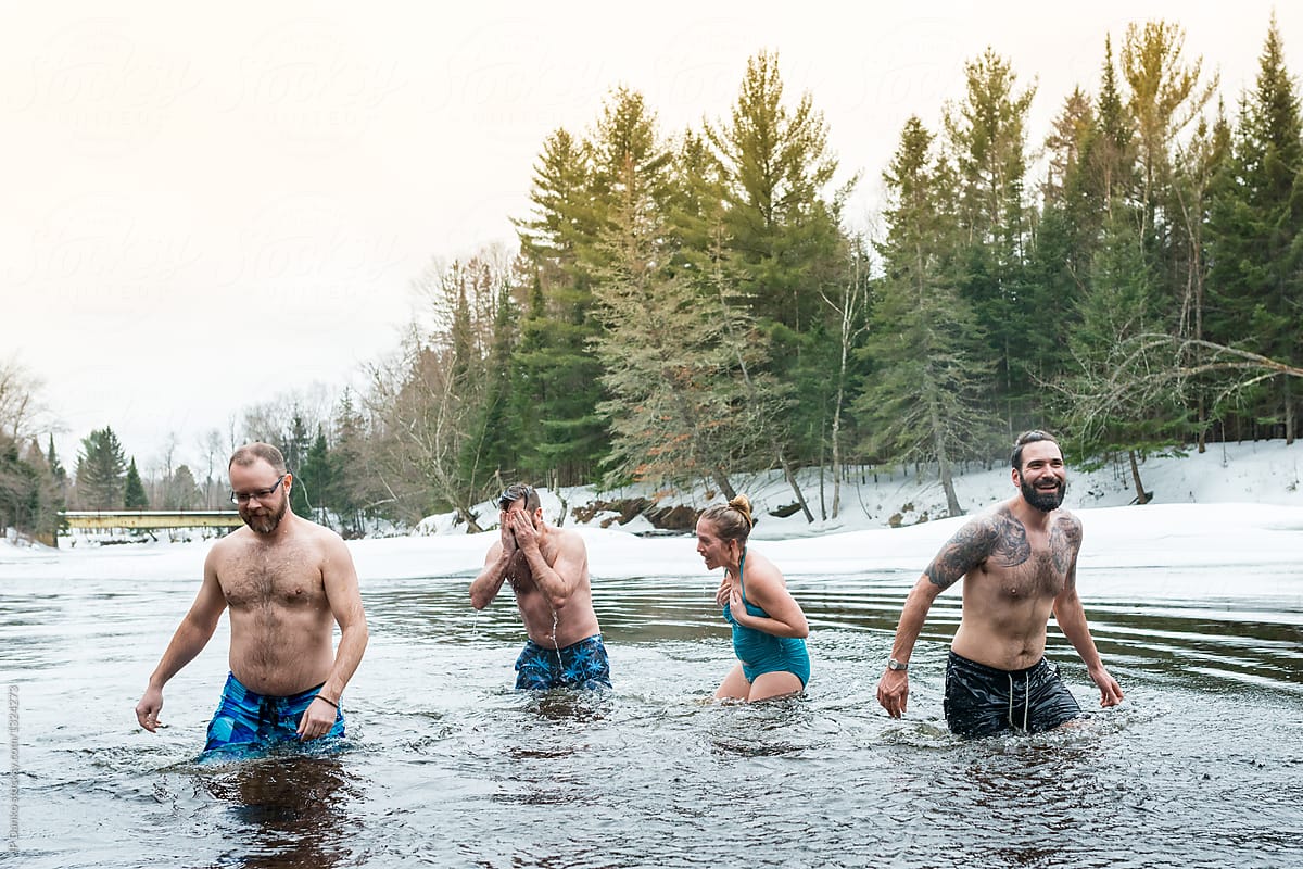Group of Friends Swimming In Ice Cold Frozen Winter River Polar Bear Dip