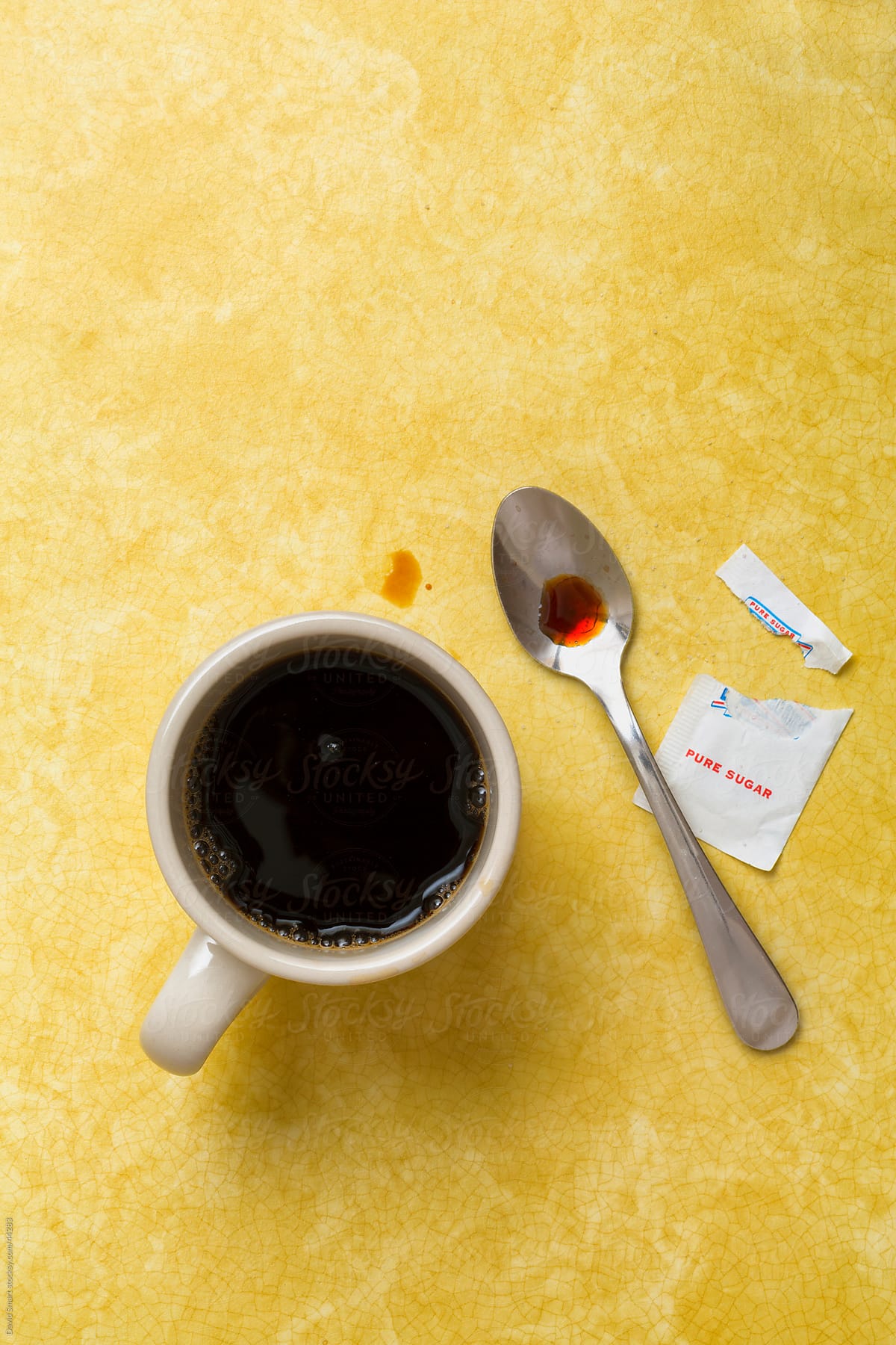 Retro coffee mug, spoon and sugar on diner counter