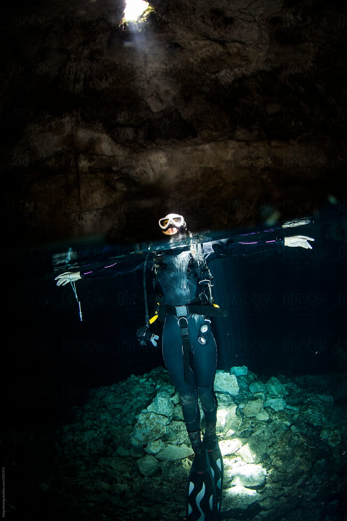 A scuba diver floating on surface in Mexico's Tajma ha Cenote