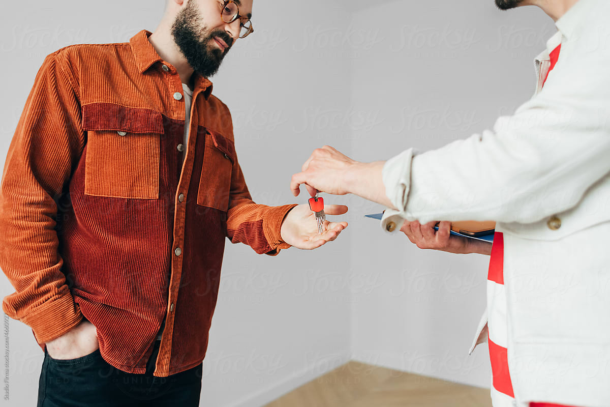 Realtor Giving Keys to Client