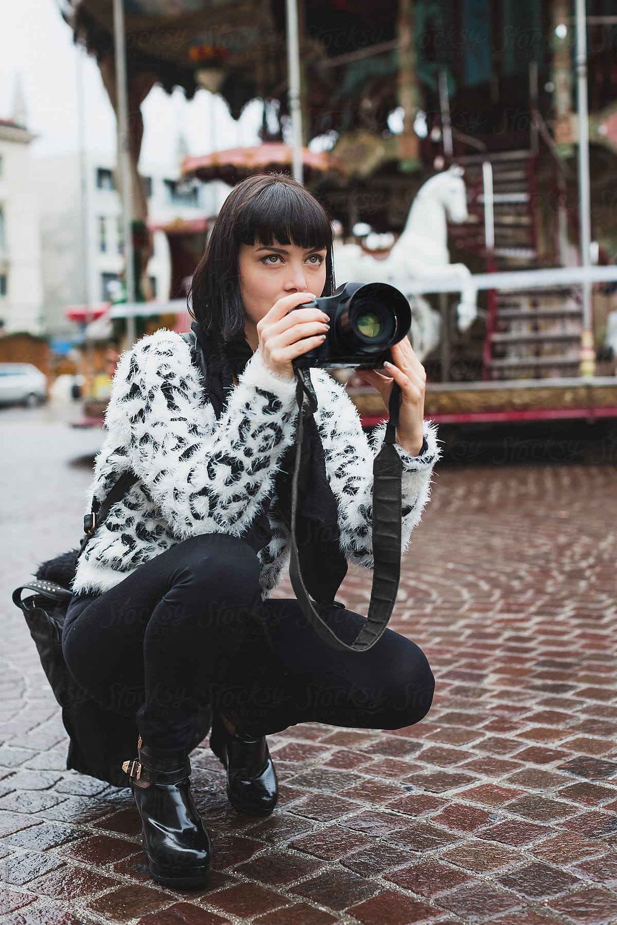 Female photographer taking pictures outdoor