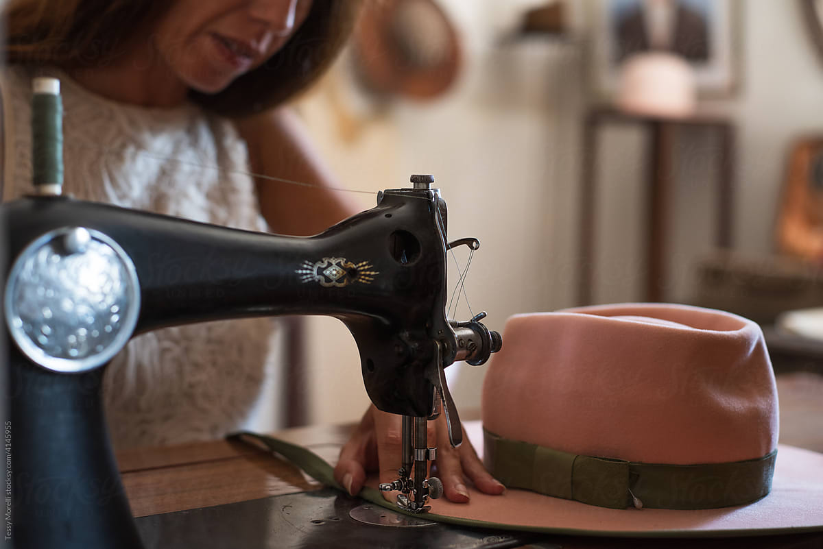 Designer at work on the antique sewing machine