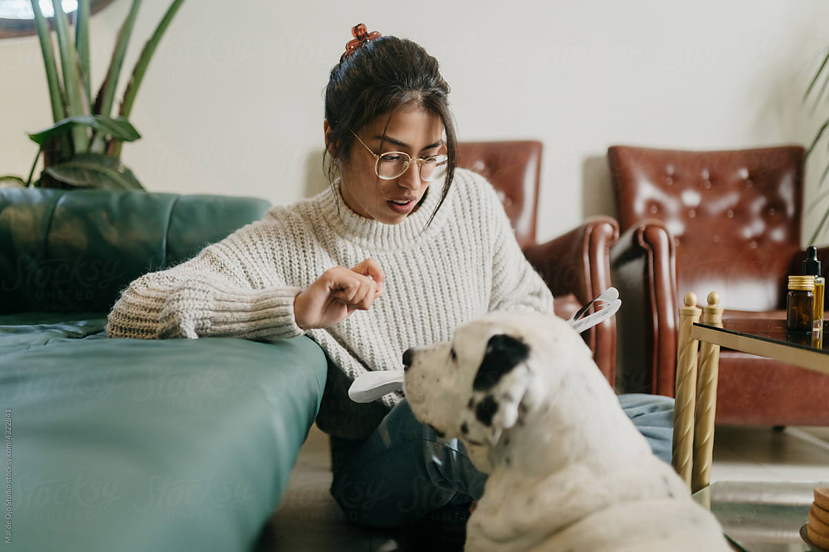 Woman and dog reading