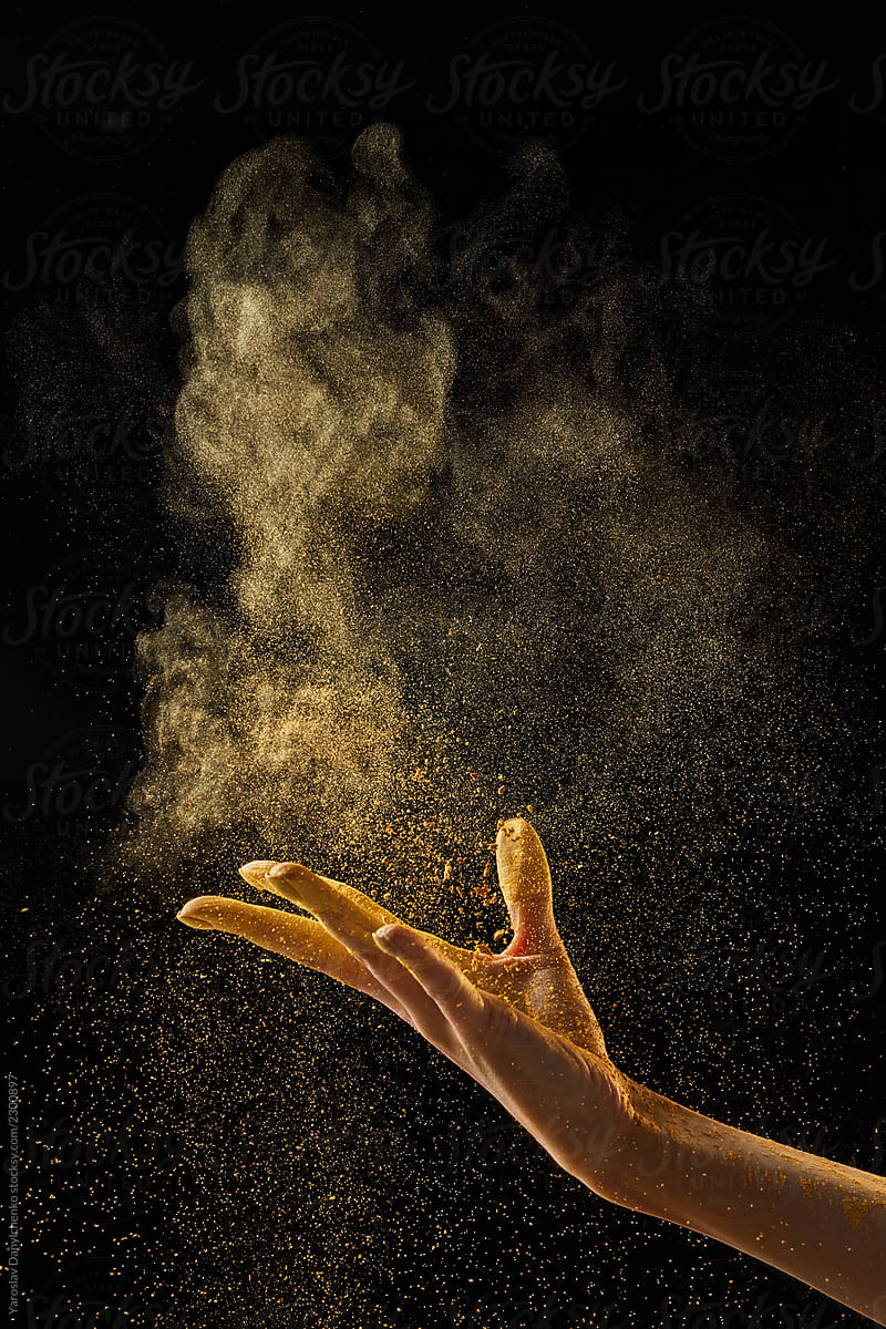 Gold Dust Falls On A Female Hand On A Black Background With Copy Space. by  Stocksy Contributor Yaroslav Danylchenko - Stocksy
