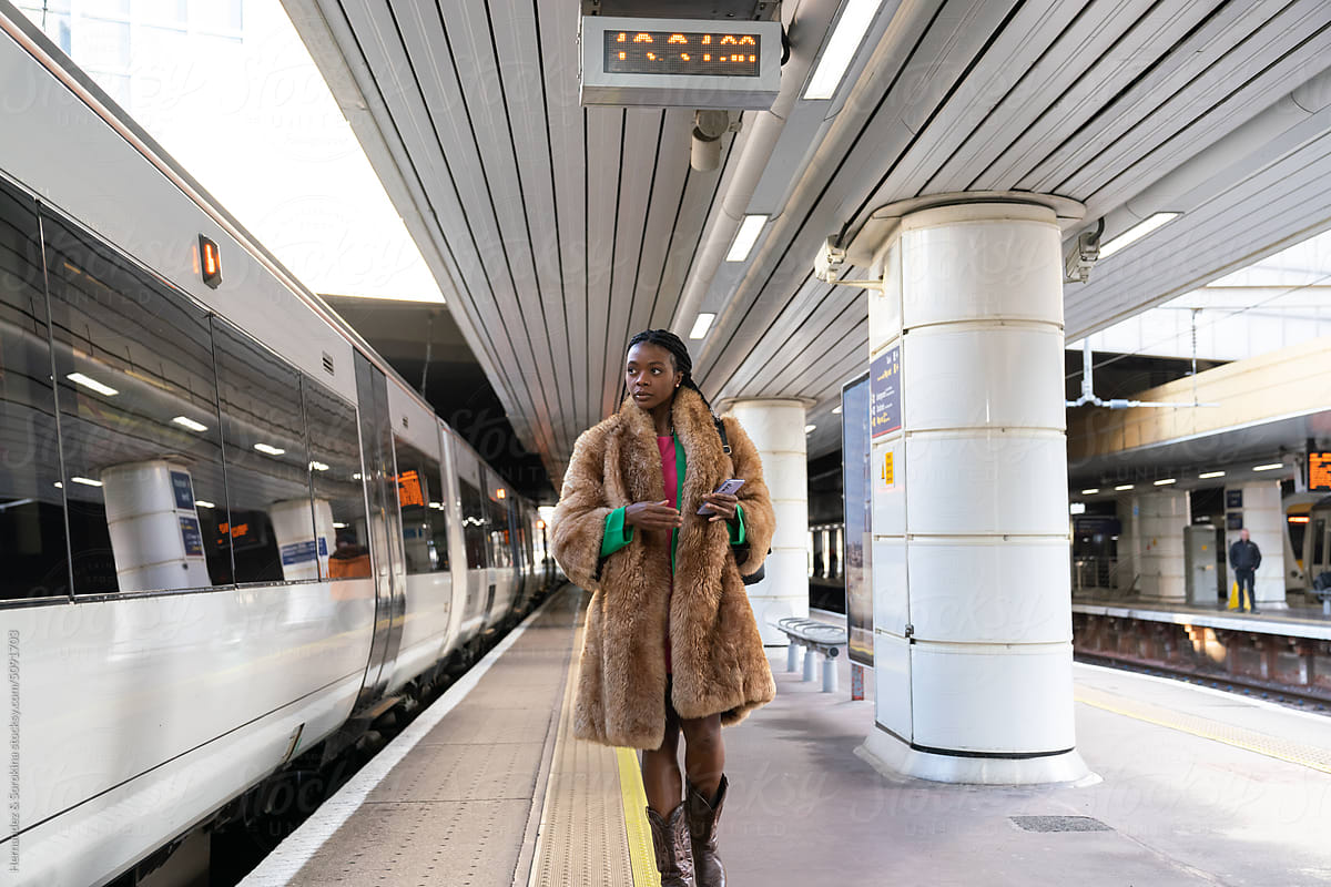 Woman Walking At Railway Station