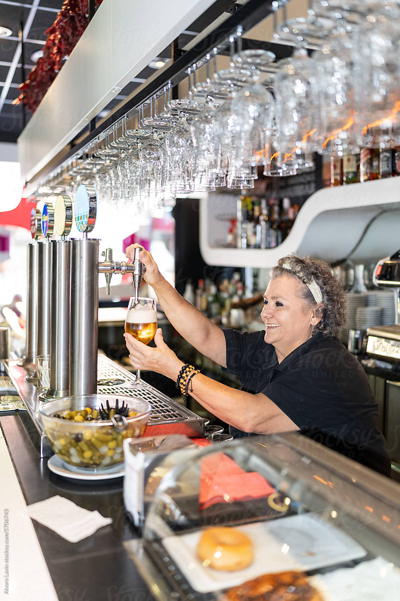 Woman working in a bar.