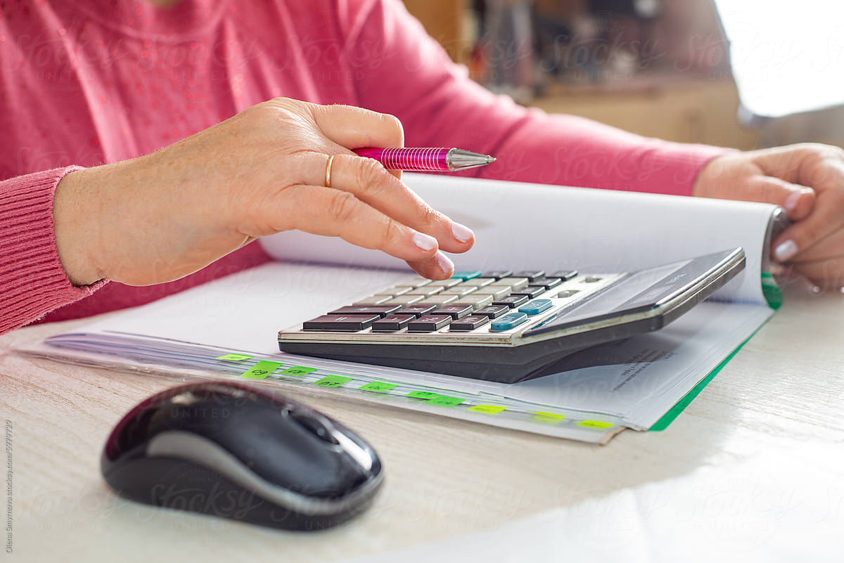 Accountant counts on a calculator