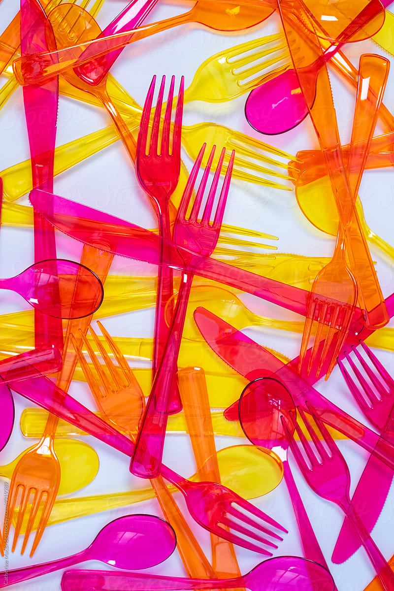 Colourful Cutlery in hap hazard arrangment