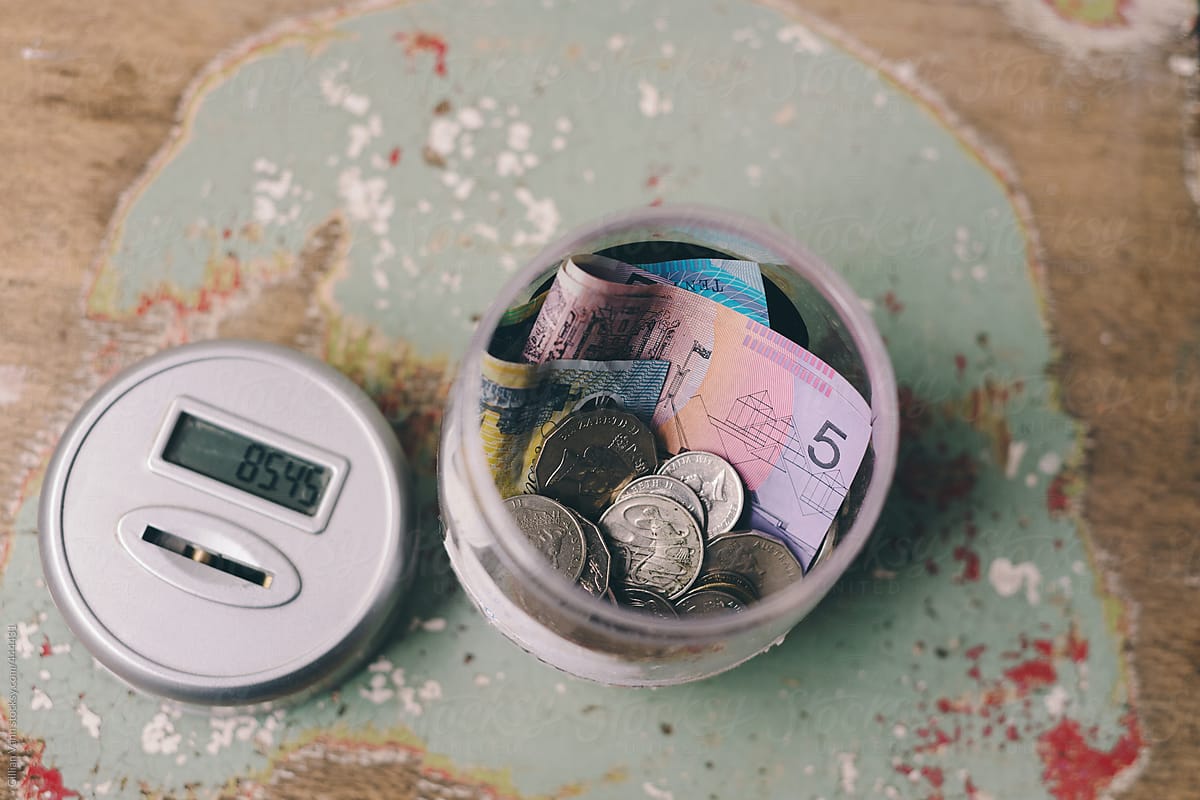 money in a money box, notes and coins, Australian