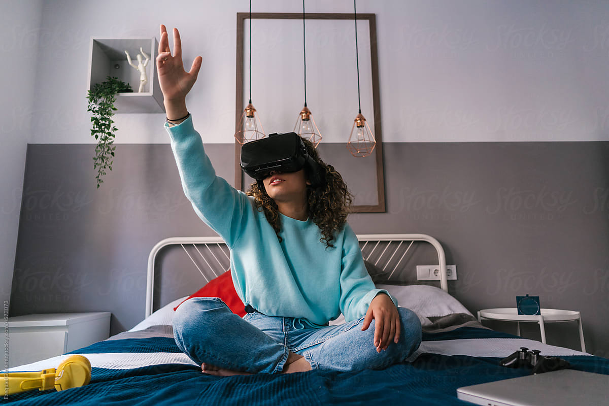 Young woman interacting with virtual reality