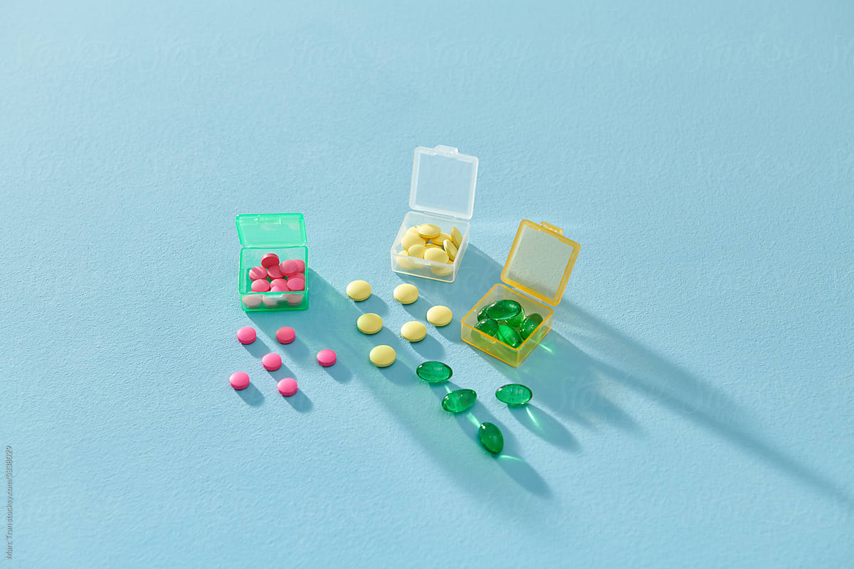Organizer for pills, vitamins and dietary supplements on a light