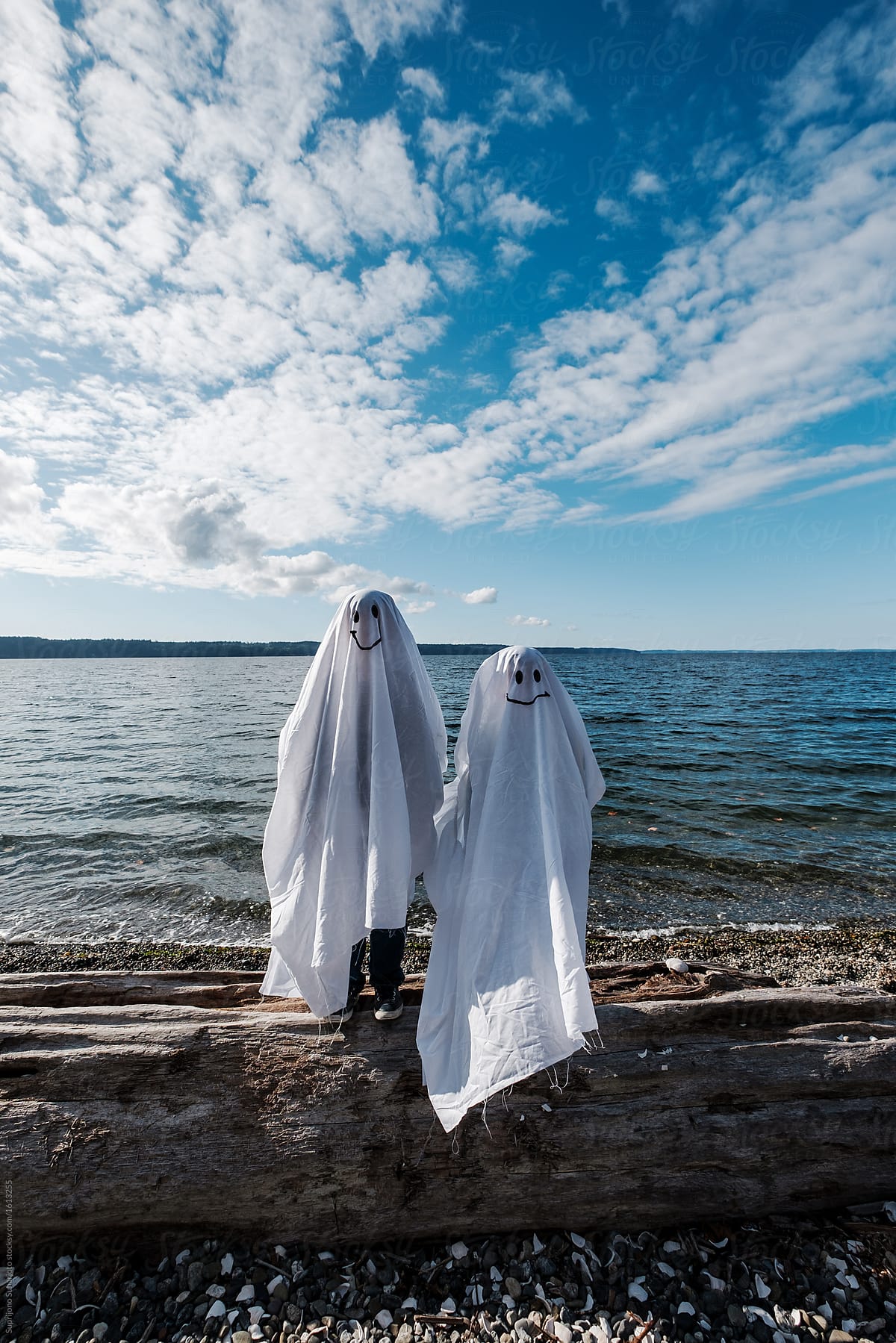 Two Kids in Ghost Costume Celebrating Halloween