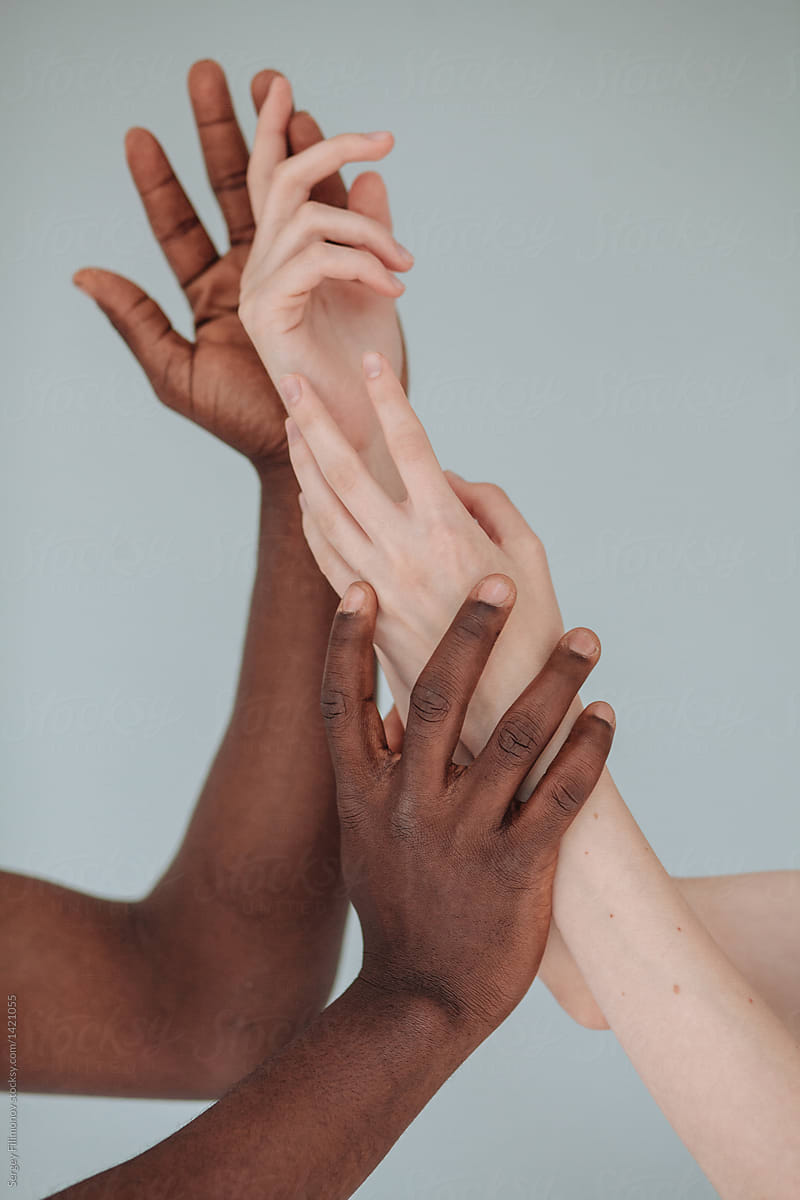 Hands of black man and white woman