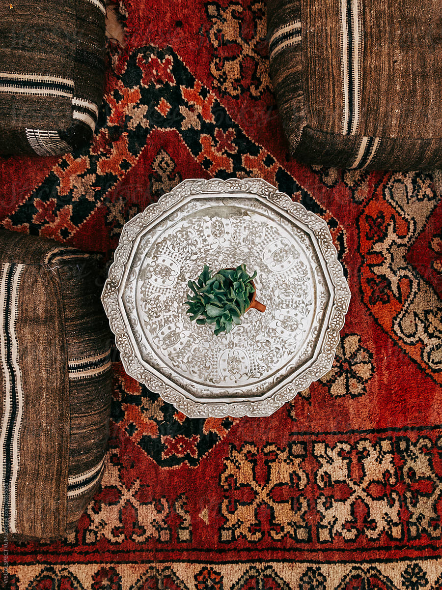 Small Silver Table on Red Moroccan Carpet