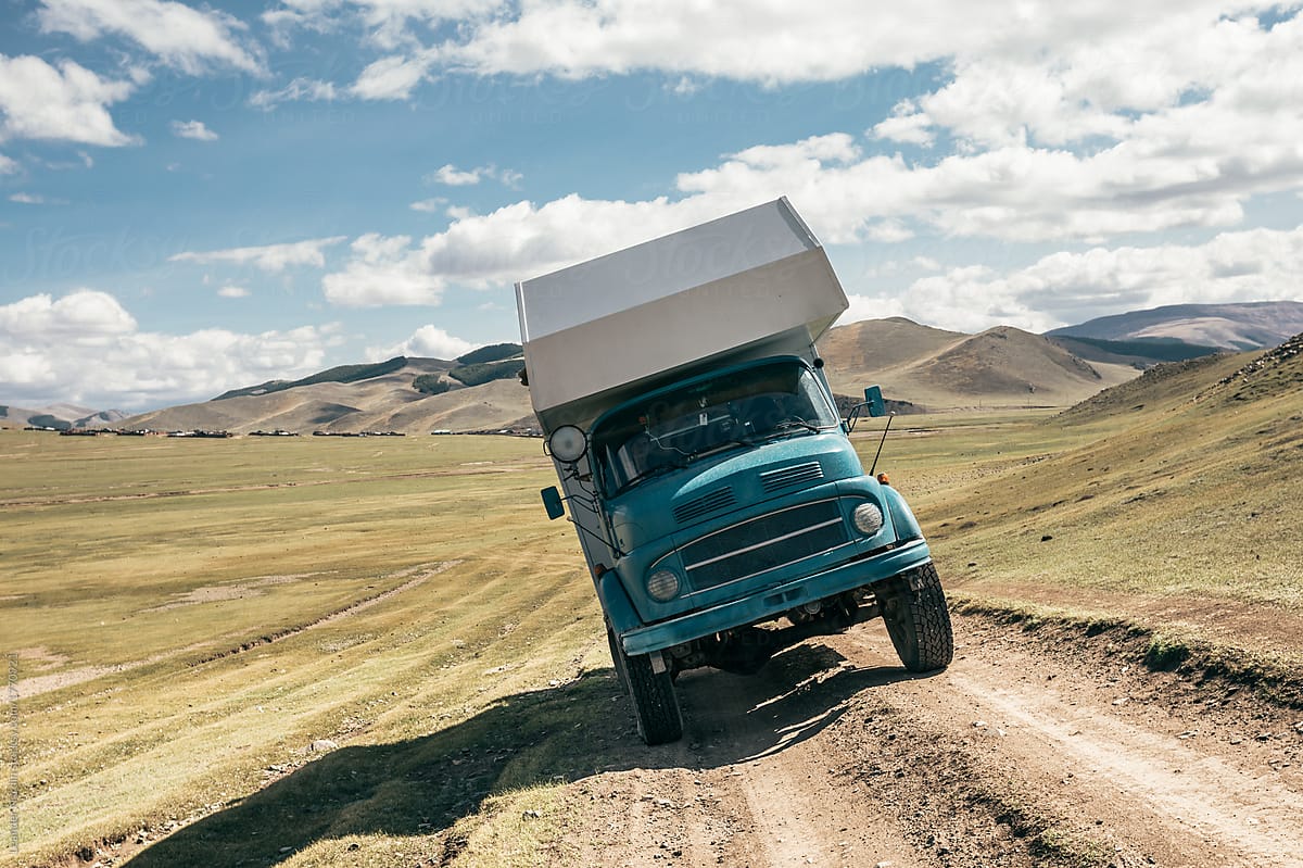 camping truck standing sideways on an offroad pist in mongolia