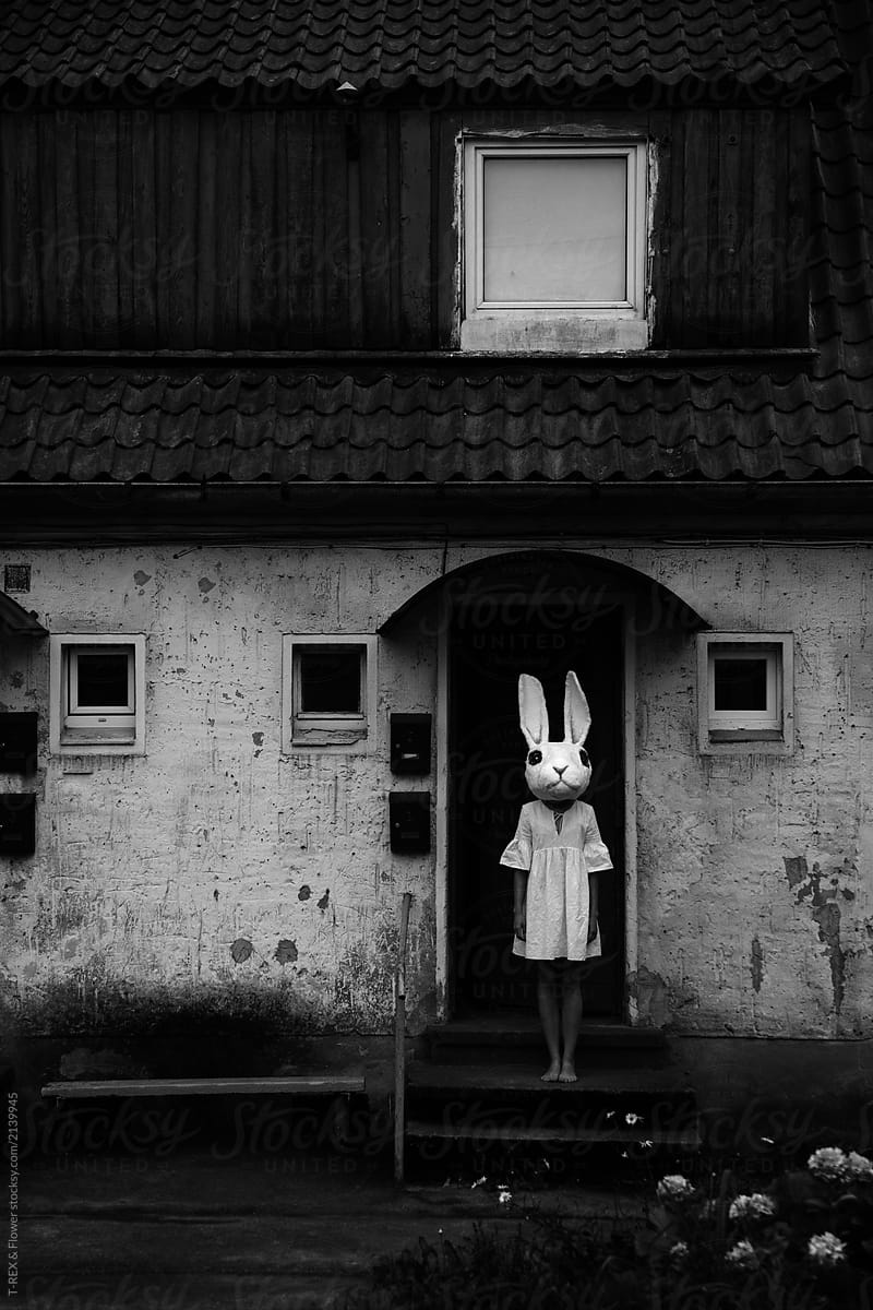 Woman in rabbit mask at house